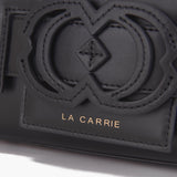 La Carrie Borsa a mano in pelle con logo sagomato in pelle nero